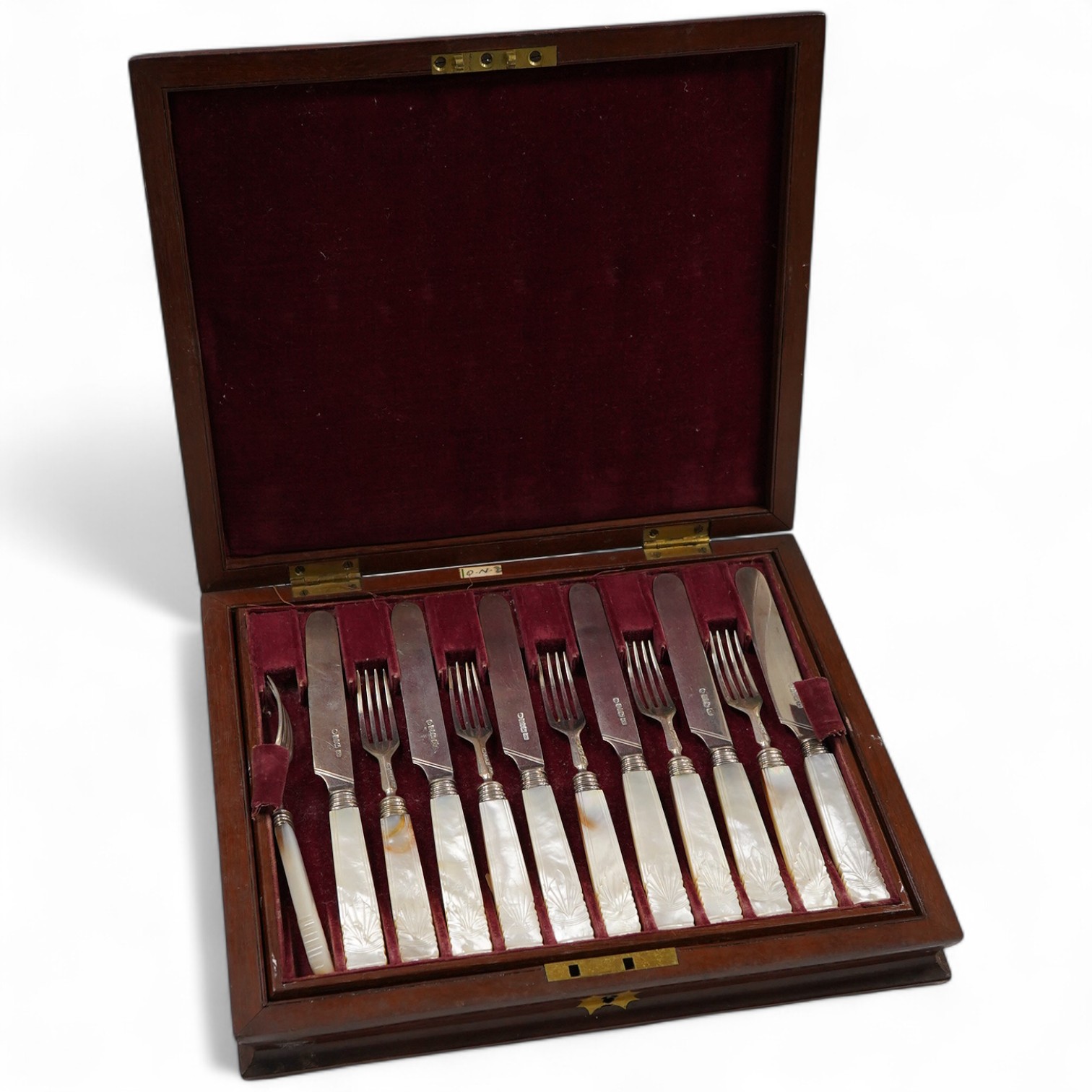 A set of twelve pairs of early Victorian mother of pearl handled dessert eaters, by Aaron Hadfield & Sons, Sheffield, 1838, no date letter on the forks, knife 19.1cm, housed in a mahogany canteen.